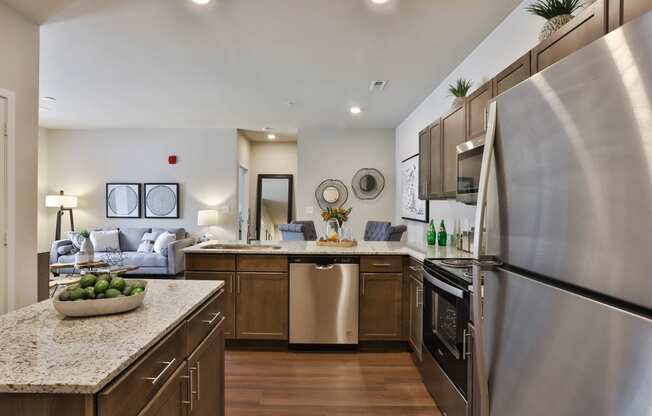 a kitchen with stainless steel appliances and granite counter tops  at Aventura at Hawk Ridge, Lake St Louis, MO, 63367