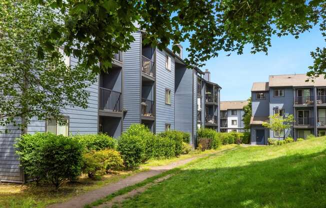 a path leading up to a row of apartment buildings at Eagles Landing Apartments, Everett, 98204