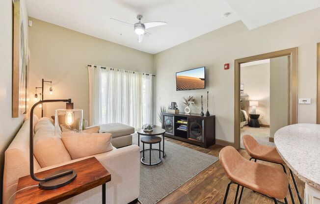 a living room with a couch and a table at Lakeline East Apartments, Cedar Park, 78613