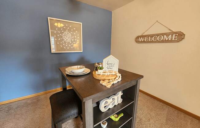 A dining table with a sign that says eat on it.
