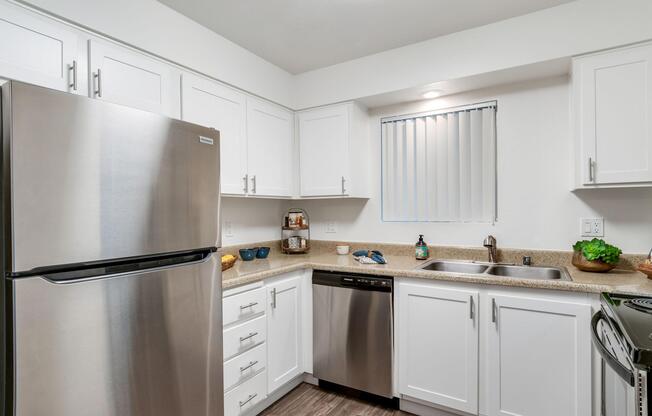 a stainless steel refrigerator in a kitchen