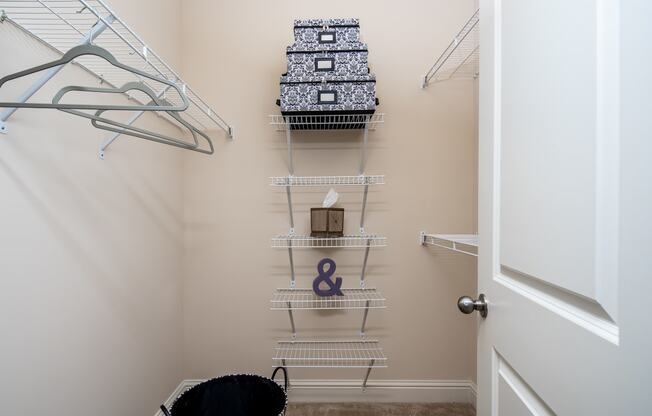 Walk-in closet with built-in shelves at Riverstone apartments for rent in Macon, GA