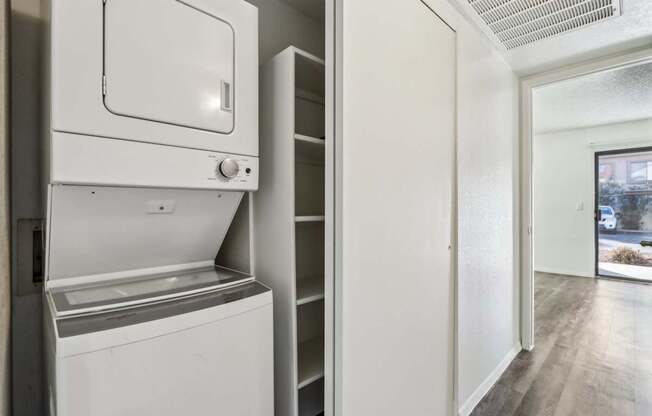 A white dishwasher and oven in a kitchen.