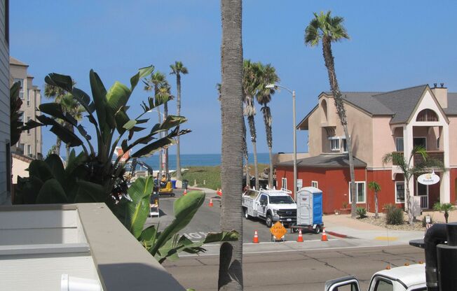 Condo with 2 car garage across from the beach