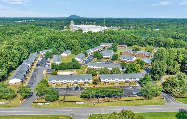 an aerial view of a apartment complex of buildings and trees