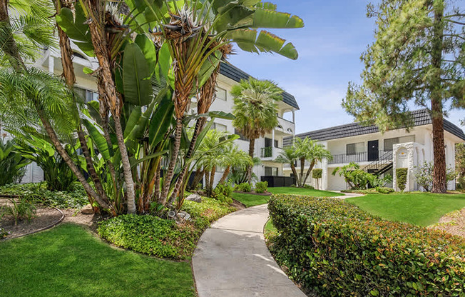 Exterior Community Building and Landscape at Palmilla Apartments located in San Diego, CA.