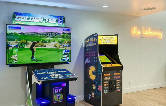 the game room has video games and a large screen tv at Presidio Palms Apartments, Arizona