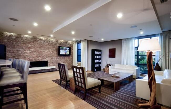 a living room filled with furniture and a flat screen tv  at The Sheffield Englewood, Englewood