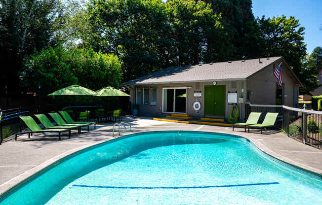 a house with a swimming pool in front of it