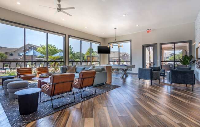 a living room with couches and chairs and a table at Sladestone Shadow Creek, Texas