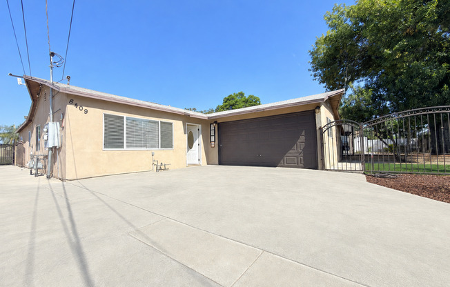 Spacious 4-Bedroom, 2-Bath Gated Home with Garage & Private Backyard