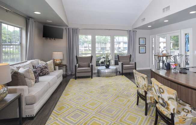 Living space and dining at Harvard Place Apartment Homes by ICER, Lithonia, GA