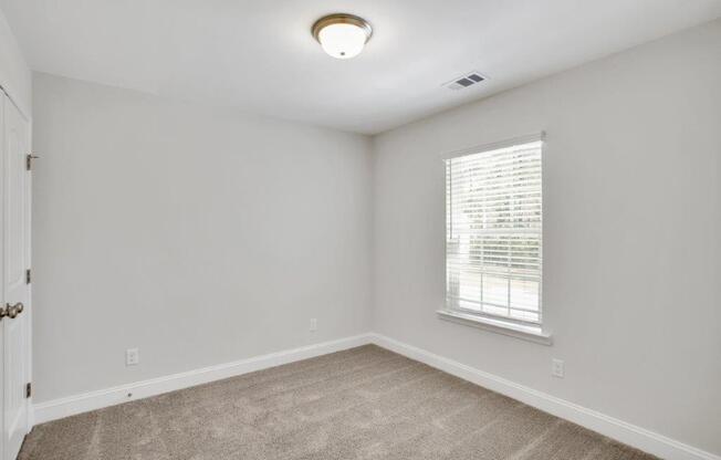 Harris Trail Luxury Townhomes for rent Richmond Hill, GA photo of bedroom with plush carpeting