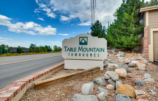 Welcome to the serene Table Mountain Townhomes, where comfort meets nature.