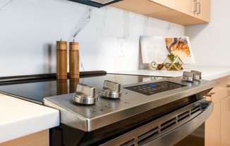 a kitchen with a stove and a sink