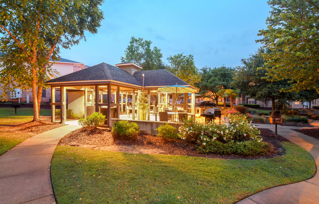 a park with a gazebo and a sidewalk at Ashford Place Apartments in Flowood, MS