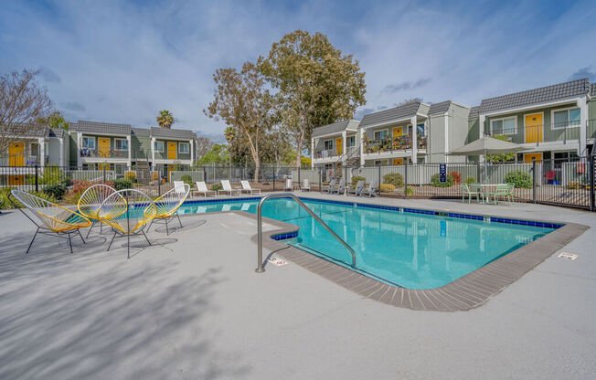 our apartments have a resort style pool and lounge chairs