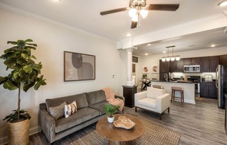 a living room with a couch and a table at Arlo Luxury homes Apartments, Little Rock, AR,72210