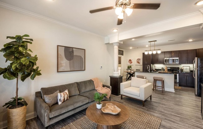 a living room with a couch and a table at Arlo Luxury homes Apartments, Little Rock, AR,72210