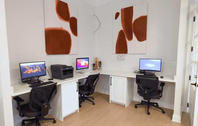 A room with two desks and two chairs.