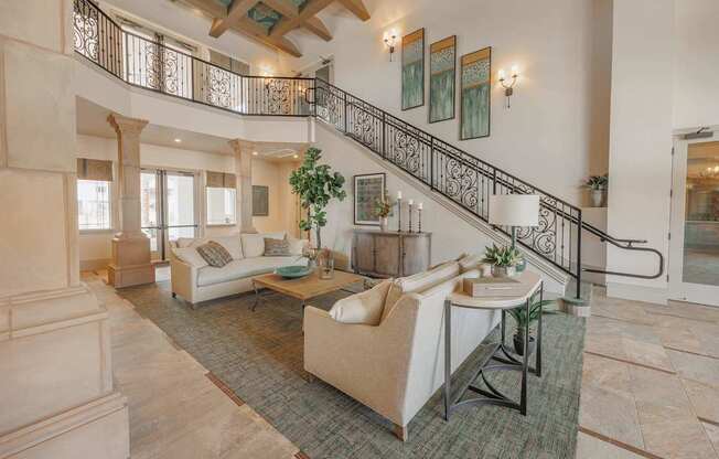 A living room with a staircase and a couch.
