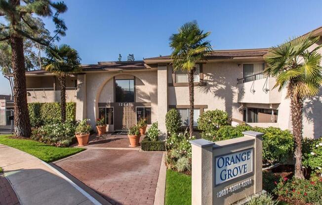 a building with an orange grove sign in front of it