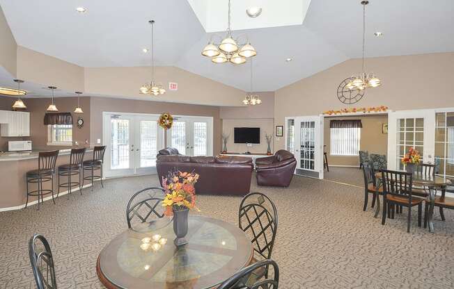 Spacious Clubhouse Lounge, Kitchen and Tables with Vaulted Ceilings