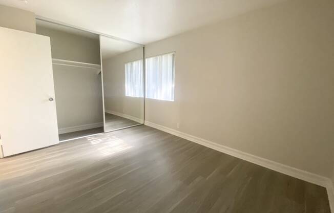 Bedroom with another view of closet