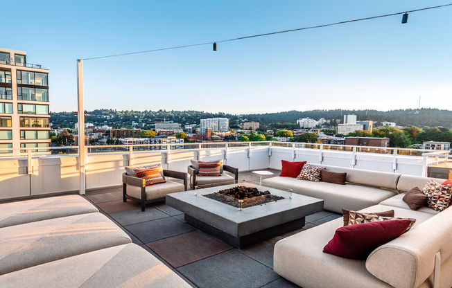 Dramatic pool with chaise lounge seating, private cabanas and stunning Portland views