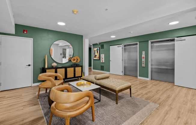 a living room with green walls and sliding glass doors