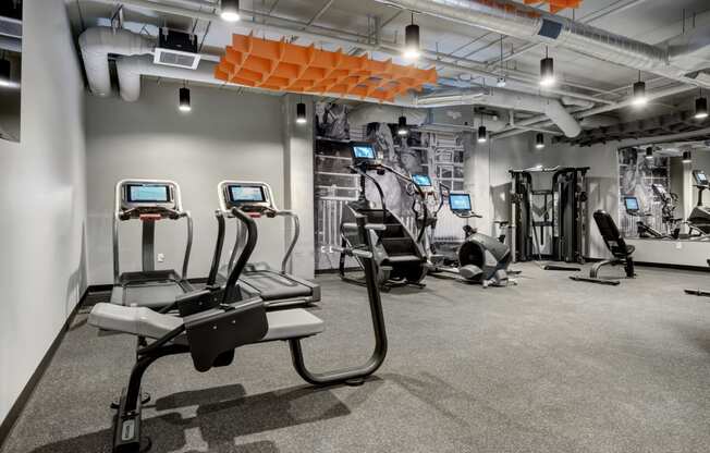 a spacious workout room with treadmills and other exercise equipment at The Yards and Backyards, Saint Paul