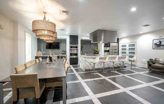 A modern dining room with a large table and chairs.