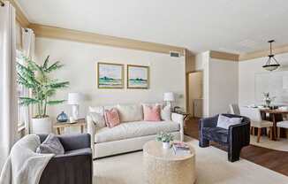 Comfortable and pet-friendly living room with neutral decor at Tattersall Village Apartments in Hinesville, Georgia