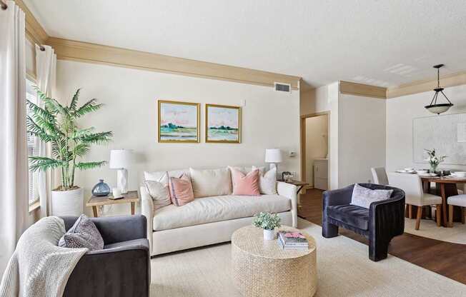Comfortable and pet-friendly living room with neutral decor at Tattersall Village Apartments in Hinesville, Georgia