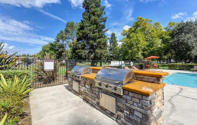 Community gas BBQ's (2) located inside the pool deck area.
