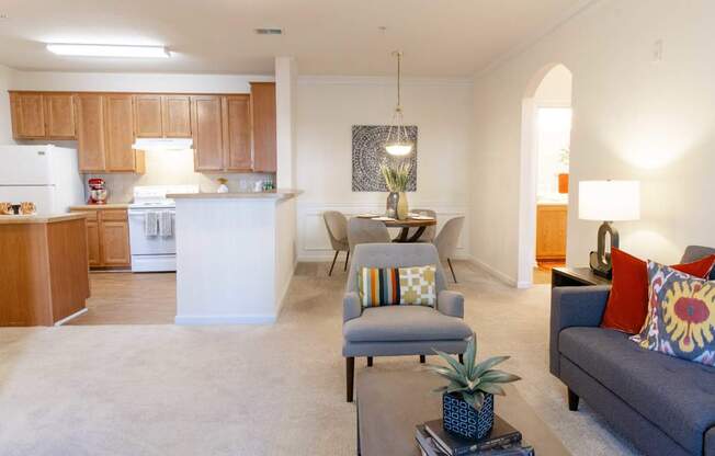 A living room with a grey couch and a coffee table.