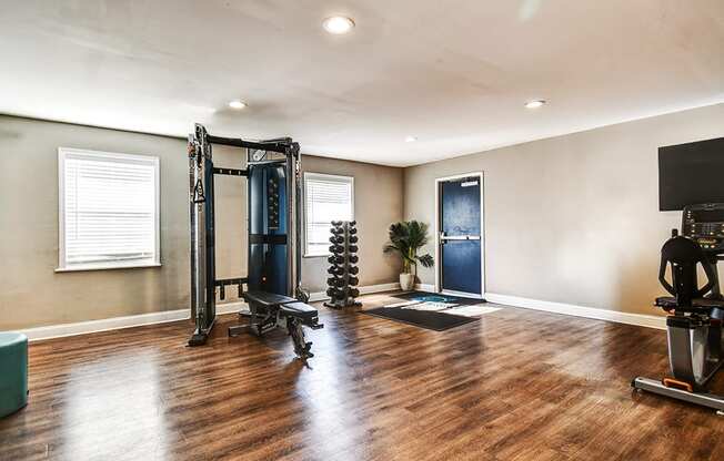 Fitness center at Ashton Brook Apartments, featuring strength equipment.