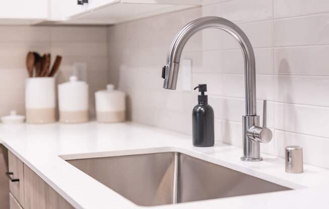a kitchen sink and faucet in a 555 waverly unit