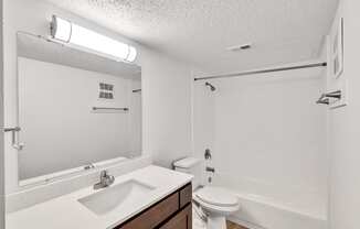 the preserve at ballantyne commons apartment bathroom with sink toilet and tub