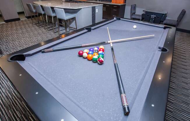 a pool table with a bunch of billiard balls on it