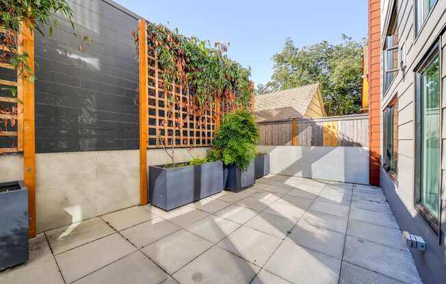 small patio with a fence and plants at The Hayes on Stone Way, Washington