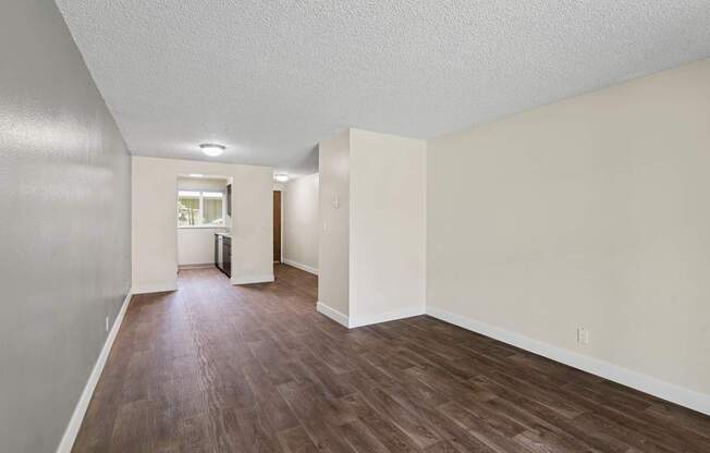 A room with wooden floors and white walls.