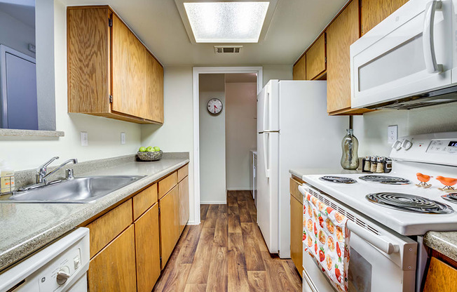 Kitchen with appliance and view to hall