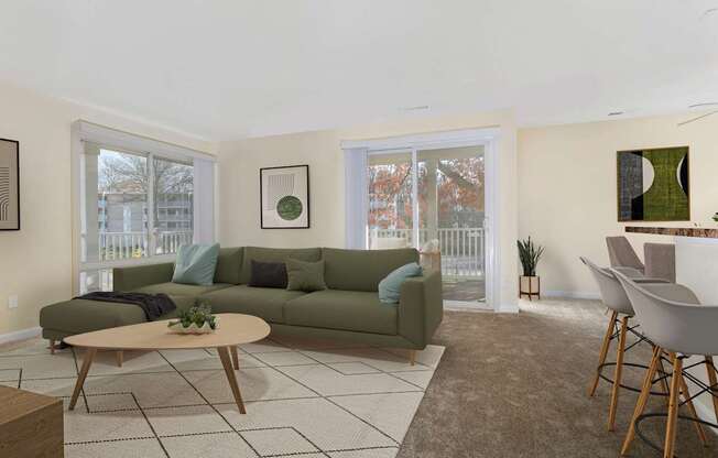 A living room with a green couch and a coffee table.