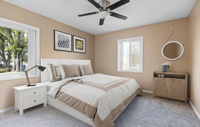 a bedroom with a bed and a ceiling fan