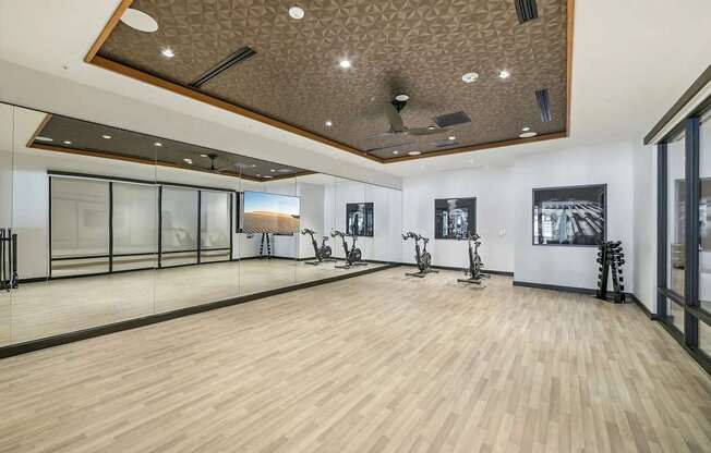 Fitness center with yoga and stretching area at Bayview Apartments, Emeryville, California, 94608