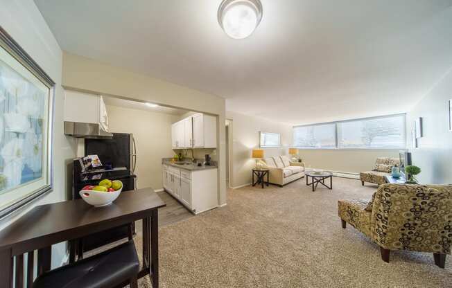 Open floor plan with kitchen, dinning area, and living room.