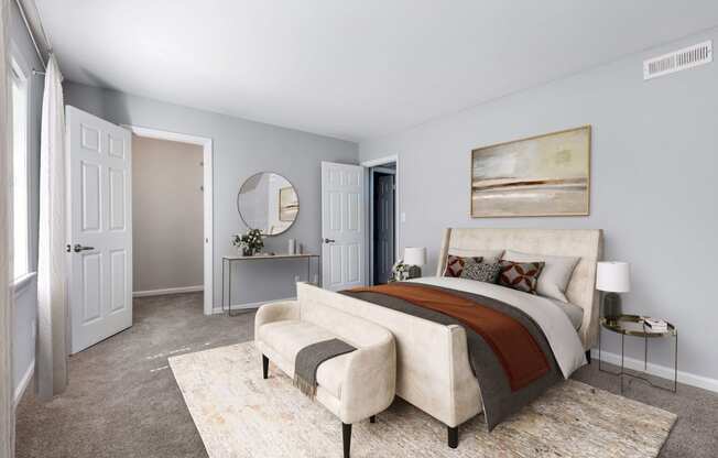 Reserve at Providence Apartment in Charlotte NC photo of a bedroom with a bed and a chair