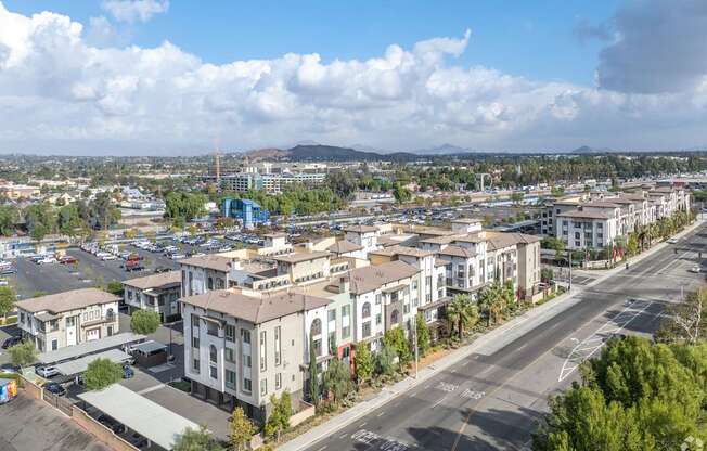 A view of a town with buildings and a road.
