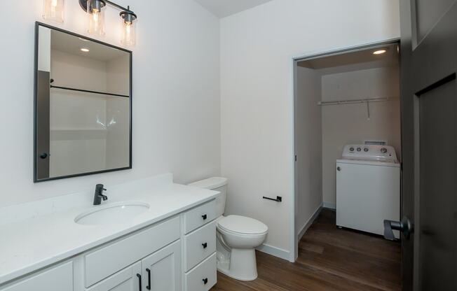 a bathroom with a sink and a toilet and a mirror at The Crossings at Windsong, Prescott Valley, 86314
